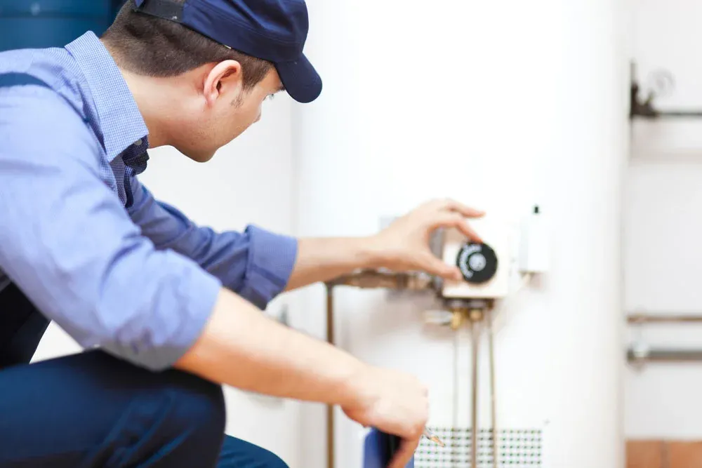 plumber checking water heater