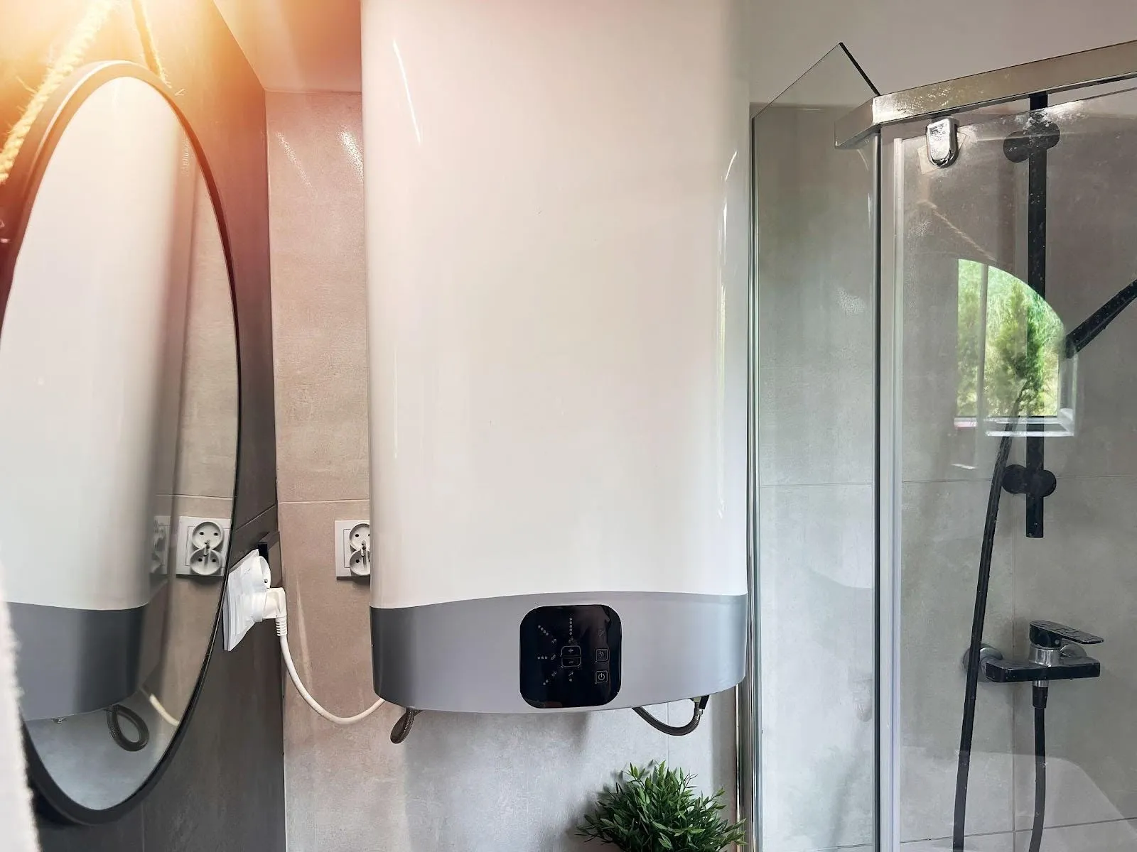 A modern bathroom with a sleek shower and stylish sink, featuring clean lines
